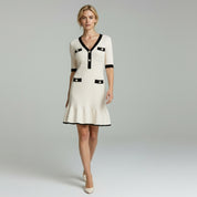 woman wearing beige elegant midi dress on a plain background